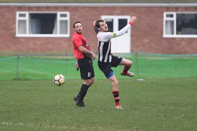 Kirton (red) v Spilsby (B/W). Mark Lovelace (red), Tom Dunderdale (B/W).
