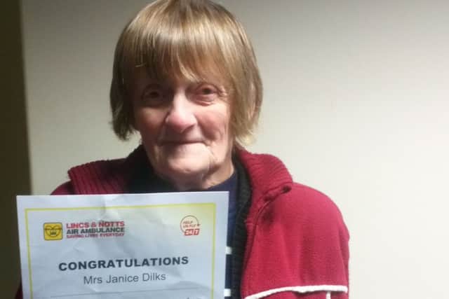 Janice Dilks with a certificate signed by the charitys CEO Karen Jobling