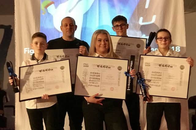 The five new black belts.