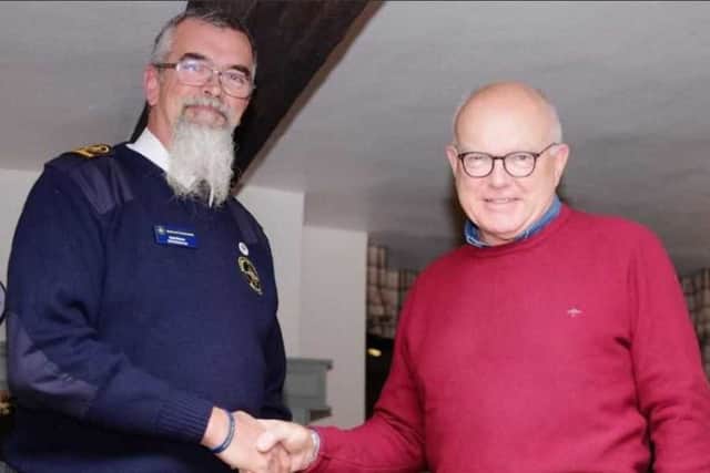 Andrew Ashworth (right), the Provincial Grand Master of Hamilton Lodge, Alford, presented a charitable donation to the Rob Druce (left).
