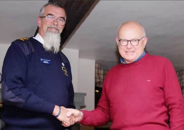 Andrew Ashworth (right), the Provincial Grand Master of Hamilton Lodge, Alford, presented a charitable donation to the Rob Druce (left).