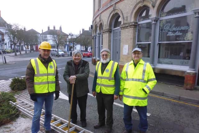Four members of the Lions task force which helped take down the towns much praised decorations.