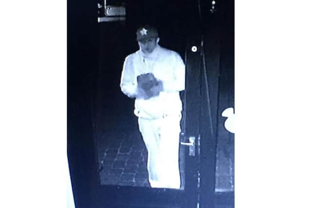 CCTV from Tablez bistro of the would-be burglar who broke a window trying to get in. EMN-190901-164142001