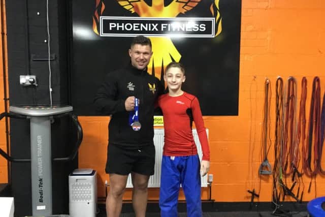 Ethan Steele and sponsor Jack Johnson, of Phoenix Fitness.