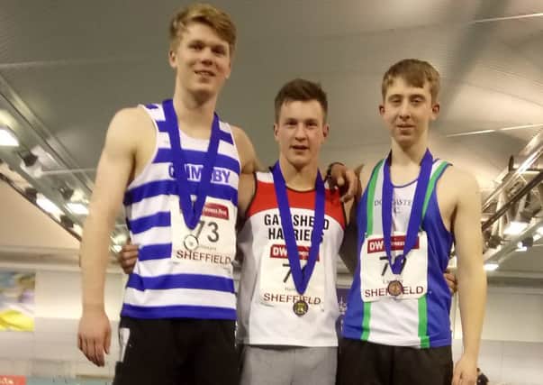 Kieran, left, is pictured with gold medallist Oliver Herring, of Gateshead, and Regan Langley, of Doncaster, who finished third.
