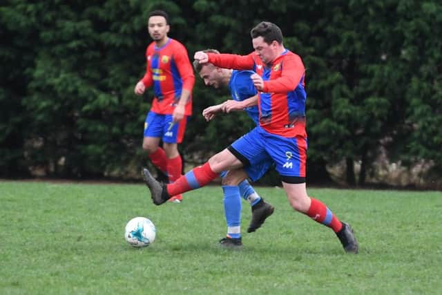 Fosdyke (blue) v Northgate Olympic (red). Jake Holland (blue), Liam Kishere (red).