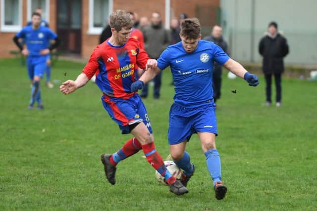Fosdyke (blue) v Northgate Olympic (red). Dean Granger (blue), Dave Cook (red).