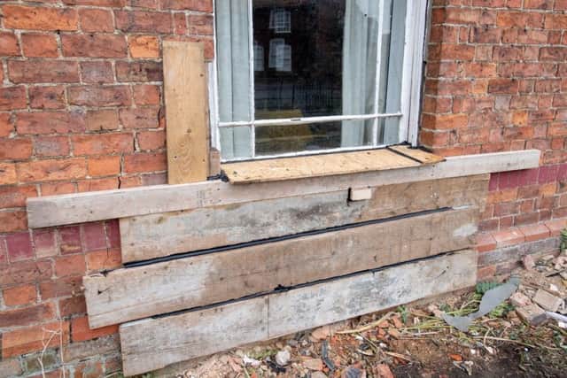 The house has been bordered up after the crash. Picture: John Aron.