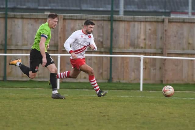 Skegness Town football action. William Britton
