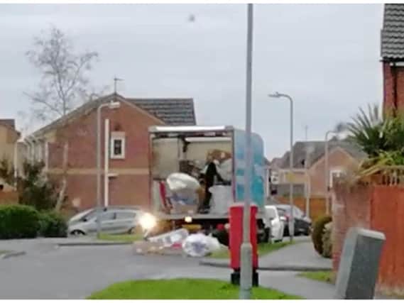 Shocking video shows delivery driver hurling parcels off his lorry onto a residential street. Photo: SWNS