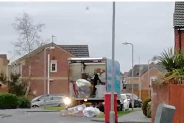 Shocking video shows delivery driver hurling parcels off his lorry onto a residential street. Photo: SWNS