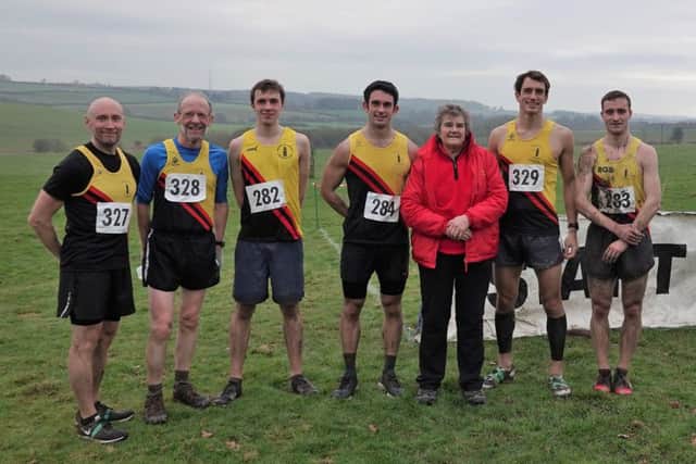 The Gold Tops's senior men's team with BADAC's Beryl Clay.
