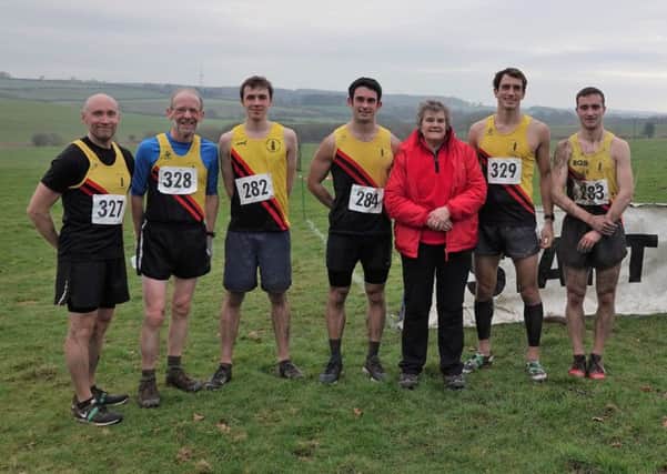 The Gold Tops's senior men's team with BADAC's Beryl Clay.