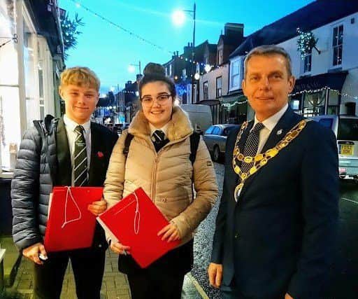 Best Christmas window display judges Head Boy Owen Holland and Head Girl Robyn Paul of King Edward VI Academy, Spilsby, with Coun Mark Gale, Mayor of Spilsby. ANL-190114-161601001