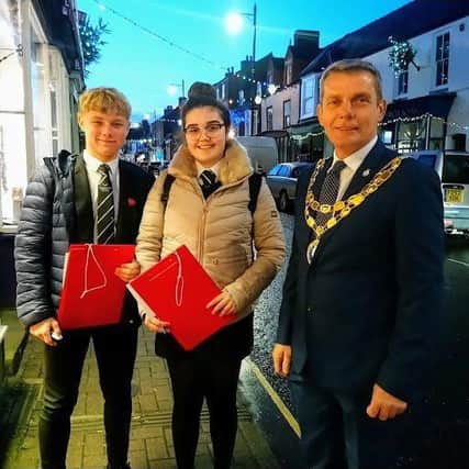 Best Christmas window display judges Head Boy Owen Holland and Head Girl Robyn Paul of King Edward VI Academy, Spilsby,  with Coun Mark Gale, Mayor of Spilsby. ANL-190114-161601001