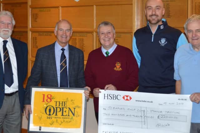 Presenting the donation. From left - Lincolnshire Freemasons Golf Association chairman Terry Little, raffle winner Ed Walters,Nick Musson, Junior Organiser at Sleaford Golf Club Dougie Coote and Association Secretary Mick Wright. EMN-190118-135823001