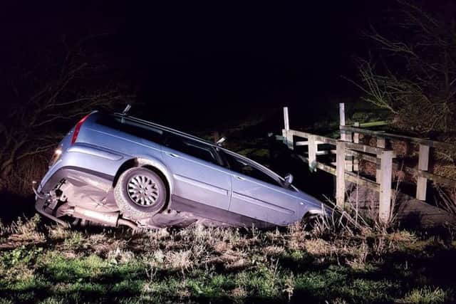 A car ended up in a ditch and a man was arrested by police.