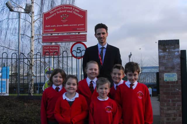 Headteacher Callum Clay and Church Lane School pupils celebrating being listed sixth in the county in the Real Schools Guide for 2019. EMN-190121-144942001