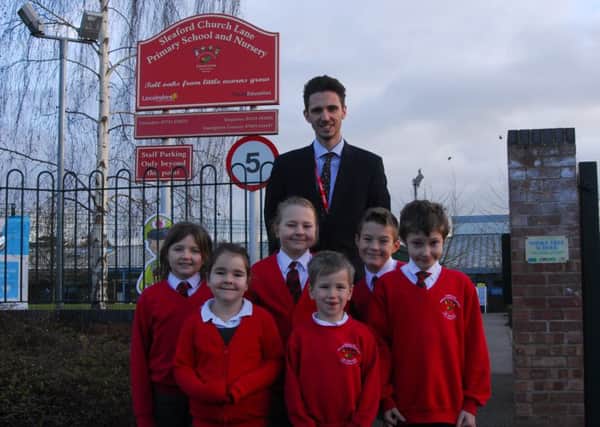 Headteacher Callum Clay and Church Lane School pupils celebrating being listed sixth in the county in the Real Schools Guide for 2019. EMN-190121-144942001