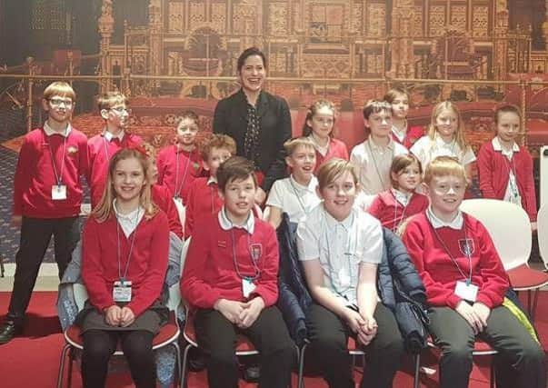 Victoria Atkins pictured with pupils.