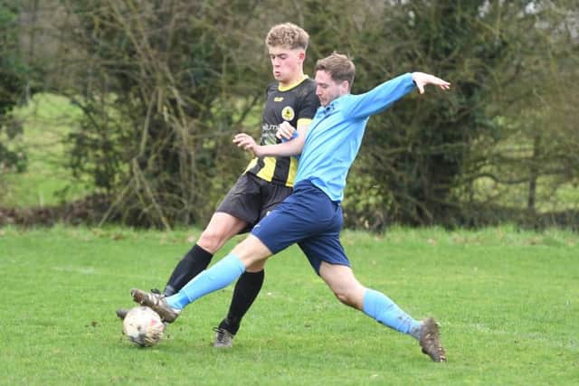 Friskney (blue) v Wyberton (yellow). Jobe Stainton (blue), Will Nuttell (yellow).