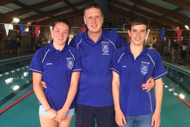 Kieva Clegg and Rico Bringeman, with coach Ian Wells.