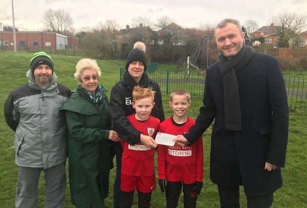 Coun Angela Clark and deputy Mayor Jon Wright presented ?1,000 to Caistor Tennyson Tigers FC EMN-190123-094200001