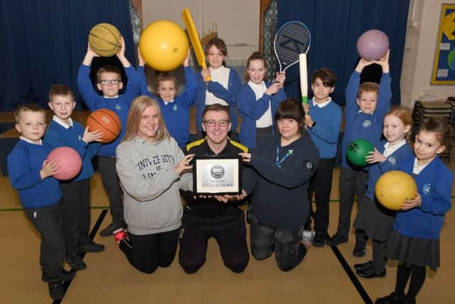 St Botolph's School, Platinum School Games Mark. Pupils pictured with L-R Emma Bellaby - deputy head, Alex Smith - active school co-ordinator, Kerry Duncan - PE co-ordinator. EMN-190124-175927001