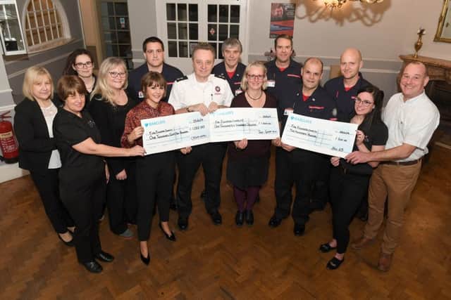 Staff at the Crown Hotel, Skegness, present a cheques to Firefighters Charity.Pictured (left to right) are Cheryl Herring, Paula Miles, Dempsey Briggs, Michelle Mosley, Abby Rawlings, Johny Lintin, Kevin Beard, Tony Edwards, Gail May, Mike Shaw, Carl Rawlings, Paul Smith, Tori Bryan, Wayne Topley. (Firefighters were from Wainfleet. Gail May and Wayne Topley were presenting a cheque on behalf of Sue&Geoff Hill) ANL-190128-121327001