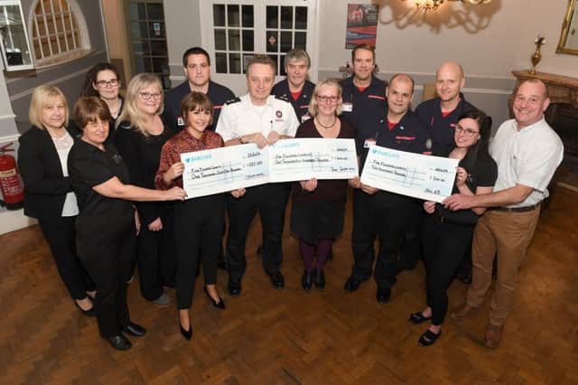 Staff at the Crown Hotel, Skegness, present a  cheques to Firefighters Charity.Pictured (left to right) are Cheryl Herring, Paula Miles, Dempsey Briggs, Michelle Mosley, Abby Rawlings, Johny Lintin, Kevin Beard, Tony Edwards, Gail May, Mike Shaw, Carl Rawlings, Paul Smith, Tori Bryan, Wayne Topley. (Firefighters were from Wainfleet. Gail May and Wayne Topley were presenting a cheque on behalf of Sue&Geoff Hill) ANL-190128-121327001