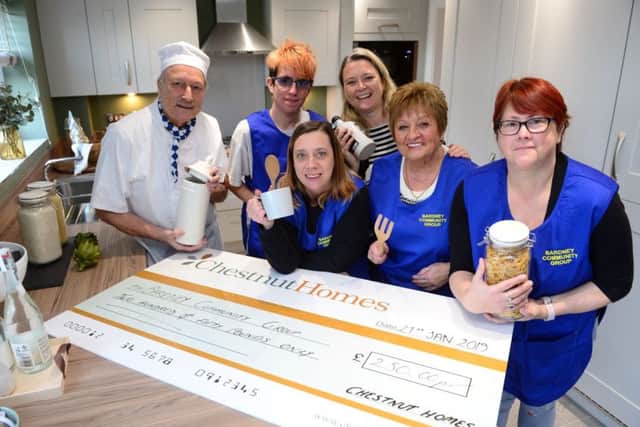 Left to right: Steve Dean, Chairman of the Bardney Community Group, with group members Mathew Sibley, Kirsten Sibley, Gloria Carter and Melanie Welburn, with Steph Tilley of Chestnut Homes, rear centre EMN-190124-122211001