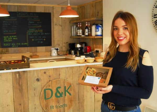 Kim Saddey with one of the healthy meal boxes created by her sister Dominique for their blossoming business, D and K Fit Foods, that has just opened in Sleaford. EMN-190124-181201001