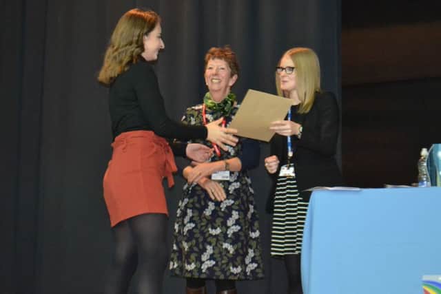 Millie Randall from Wellingore receiving her Outstanding A Level Award from Head of Sixth Form Charlotte Wilson guest speaker Liz Rijnenberg. EMN-190128-121229001