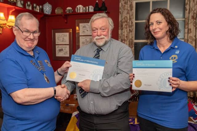 Lions President John Ginty with new member Richard Brown and sponsor Katie Liddy. Photo: John Aron.