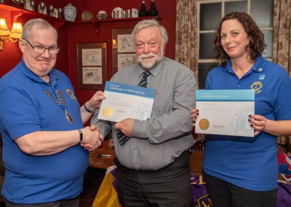 Lions President John Ginty with new member Richard Brown and sponsor Katie Liddy. Photo: John Aron.