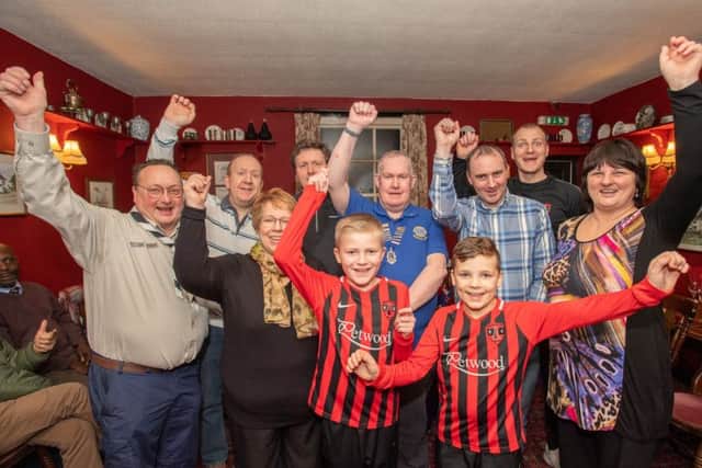 All smiles: Woodhall Spa Lions Club presented cheques to charities and groups, including Woodhall Spa Football Club and Woodhall Spa Scouts. Picture: John Aron.