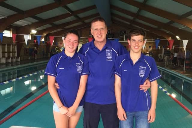Kieva Clegg and Rico Bringeman with coach Ian Wells.