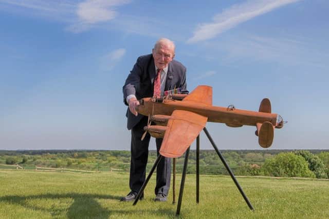 George 'Johny' Johnsson with a model of the Lancaster sculpture. EMN-190128-150722001