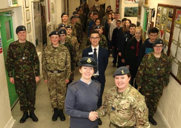 Hand over. Flt Lt Leigh Withnall passes command of Sleaford ATC Squadron to Pilot Officer Karen Turner. EMN-190402-173336001