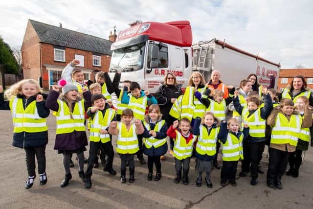 Osbournby Primary School children get their hi-viz waistcoats from G R Ward Transport. EMN-190402-145414001