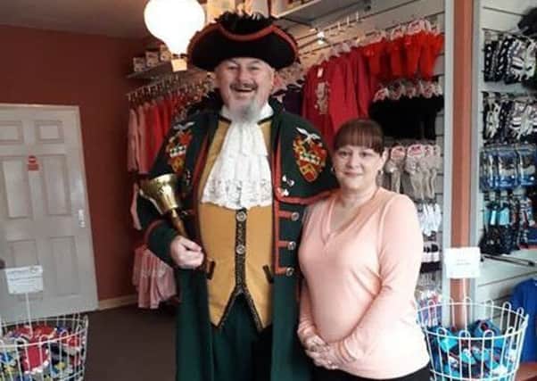 Shop owner Lorraine Buckley with Sleaford Town crier John Griffiths. EMN-190131-171708001