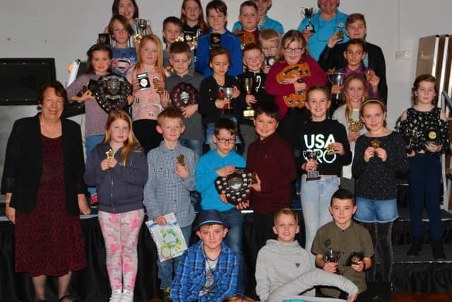 All award and trophy winners with Club captain, Jackie Ross, resting at the front and Club president, Fiona Martin MBE, at the side.