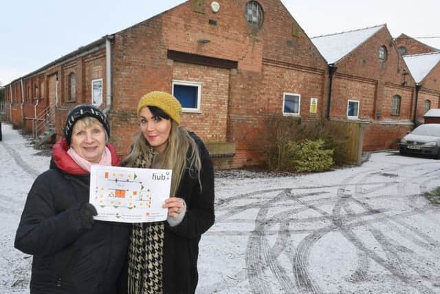 Linda Baxter and Sam Beeson, with their plans to turn a vast disused warehouse into a community hub.