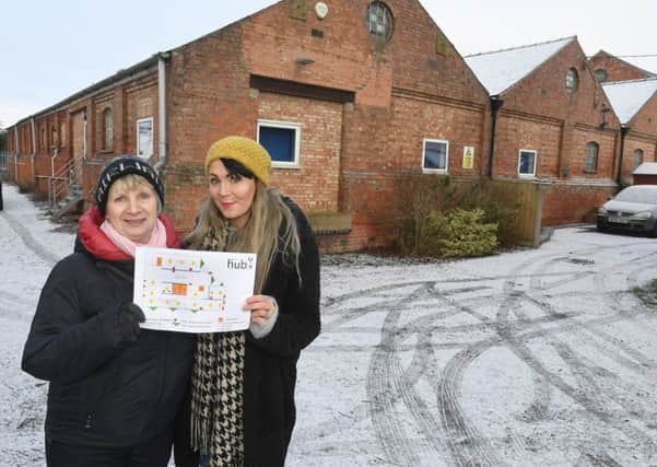 Linda Baxter and Sam Beeson, with their plans to turn a vast disused warehouse into a community hub.