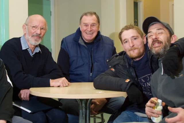 Lincolnshires most senior Freemason, Dave Wheeler, centre, andProvincial Charity Steward Pete Tong met clients of Grimsbys Harbour Place when they visited to hand over a ?5,000 donation from the Masonic Charitable Foundation. EMN-190402-150228001