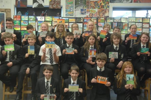 Some of the pupils who have created a postcard showing their favourite thing about Market Rasen EMN-190502-092340001