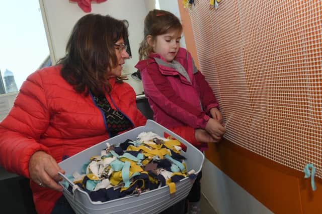 Big Community Weave at National Centre for Craft and Design. Yvonne Bridgewater with her grand daughter Lilly Childs 5, tying rags on a Rag Rug. EMN-190402-143602001