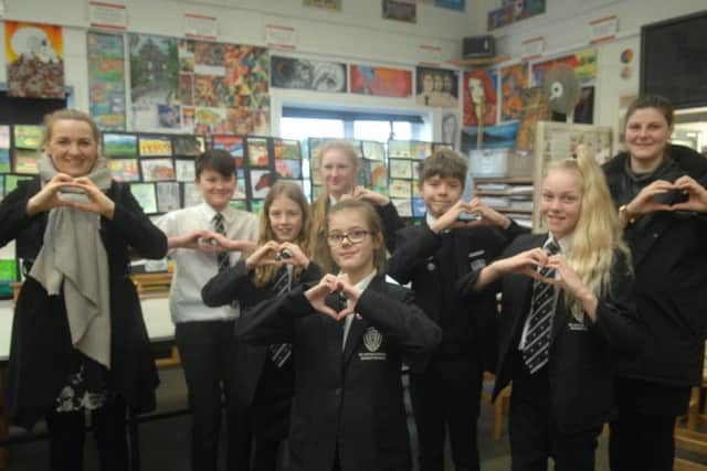 Students show the love with, below Sian Williams and Patricia Grove from Market Rasen Racecourse EMN-190502-092301001