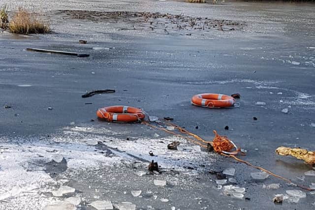 Life saving rubber rings were thrown onto the frozen pond. Picture: Jonathan Schofield. EMN-190402-152840001