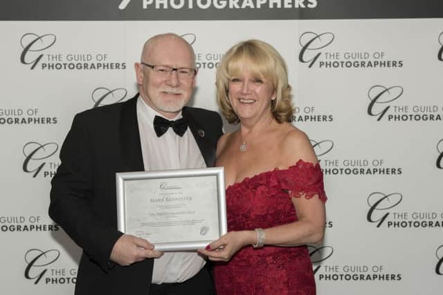 Mark Bannister with his award from The Guild of Photographers.
